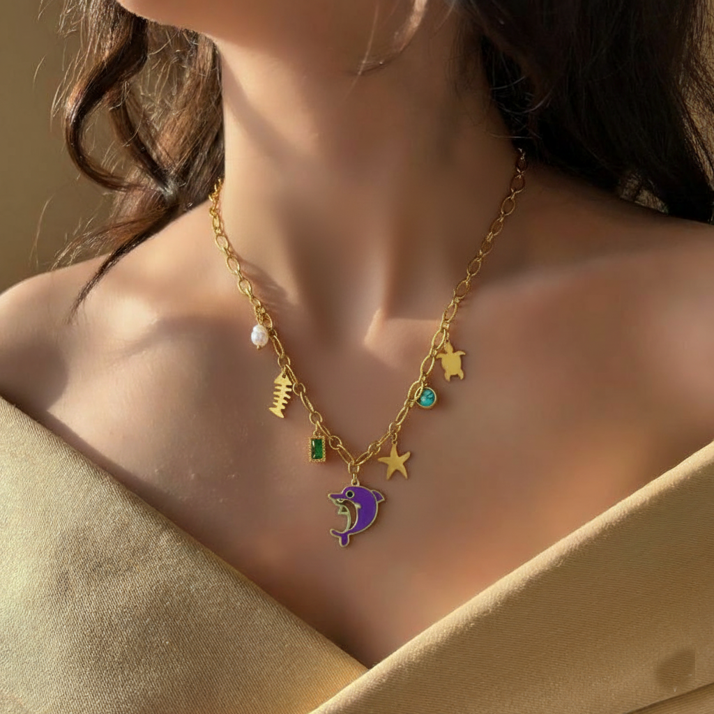 RemindraLux 18K Gold-Plated Ocean Charms Necklace with Dolphin, Starfish & Emerald Accent