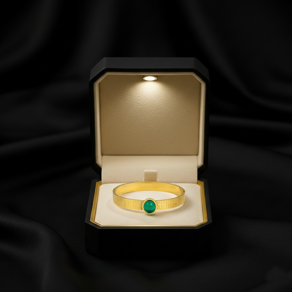 RemindraLux 18K Gold-Plated Textured Bangle with Emerald Green Gemstone