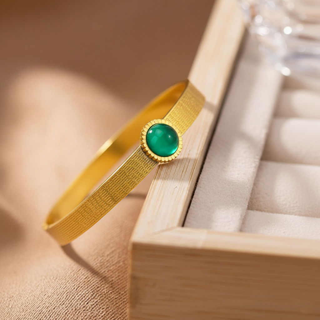 RemindraLux 18K Gold-Plated Textured Bangle with Emerald Green Gemstone