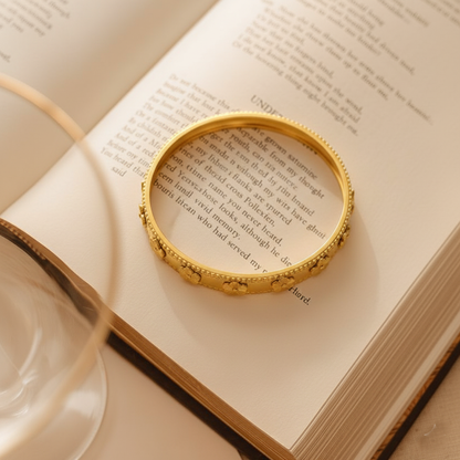 RemindraLux 18K Gold-Plated Beaded Edge Bangle with Golden Flowers