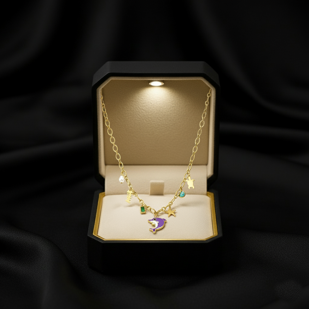 RemindraLux 18K Gold-Plated Ocean Charms Necklace with Dolphin, Starfish & Emerald Accent