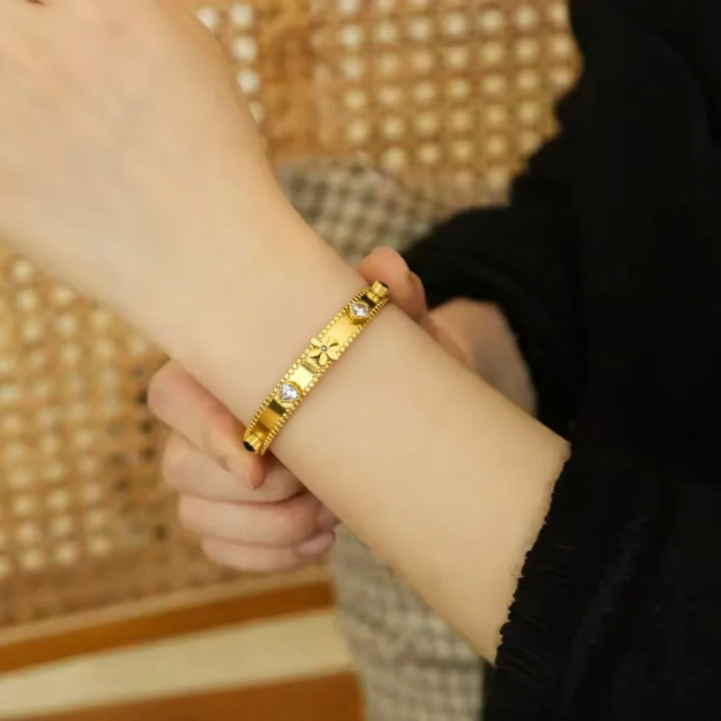 RemindraLux 18K Gold-Plated Beaded Edge Bangle with Flower, Heart & Black Star