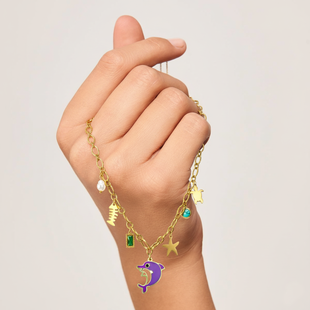 RemindraLux 18K Gold-Plated Ocean Charms Necklace with Dolphin, Starfish & Emerald Accent