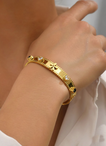 RemindraLux 18K Gold-Plated Beaded Edge Bangle with Flower, Heart & Black Star