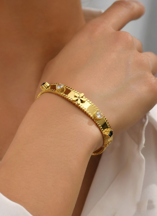RemindraLux 18K Gold-Plated Beaded Edge Bangle with Flower, Heart & Black Star